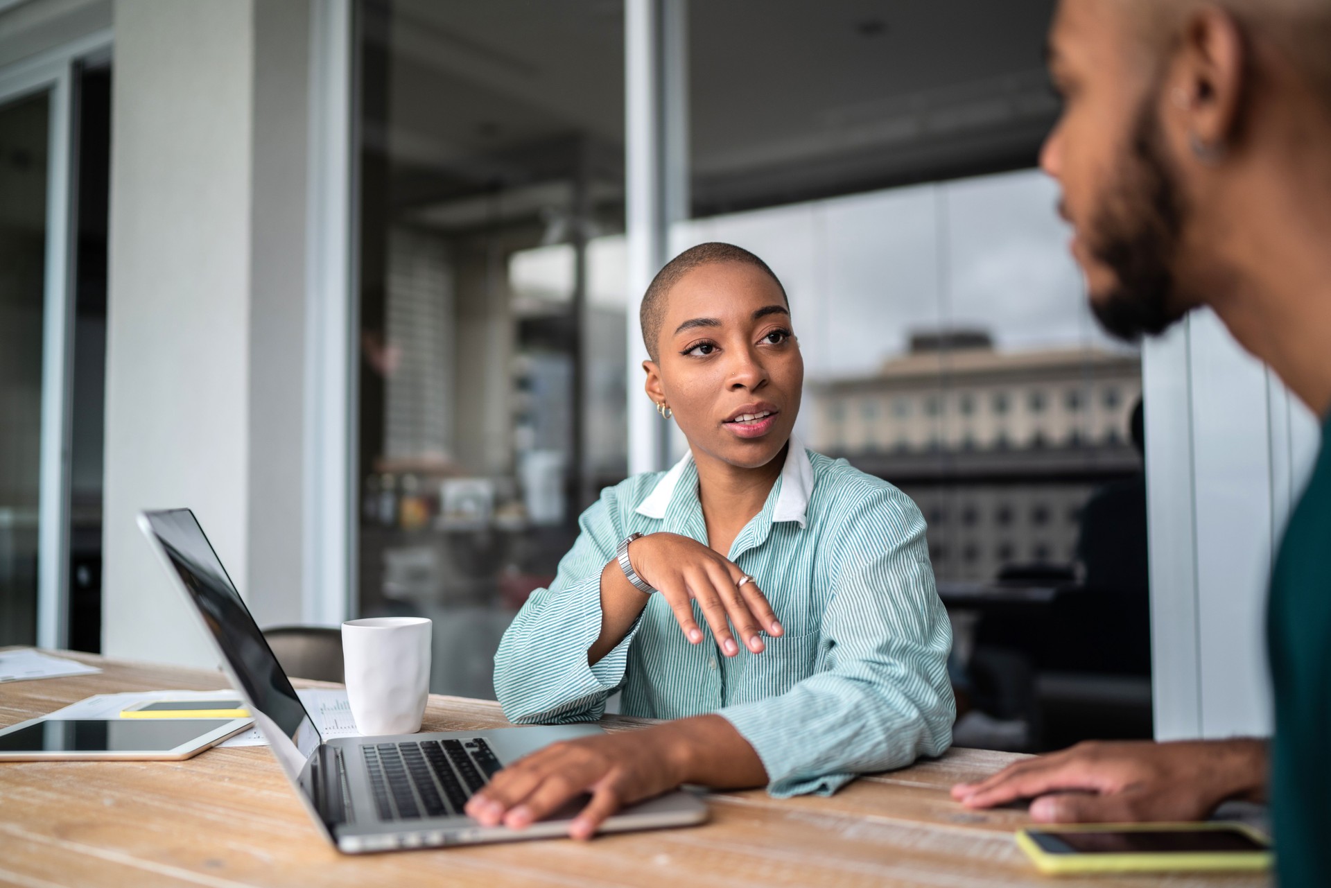 Financial advisor or real estate agent talking to customer at home